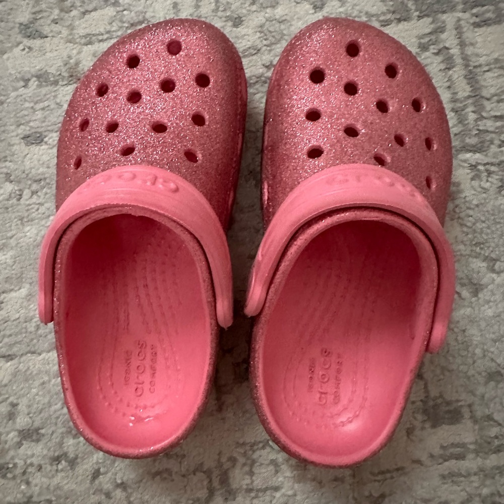 Pink glitter crocs for girls.